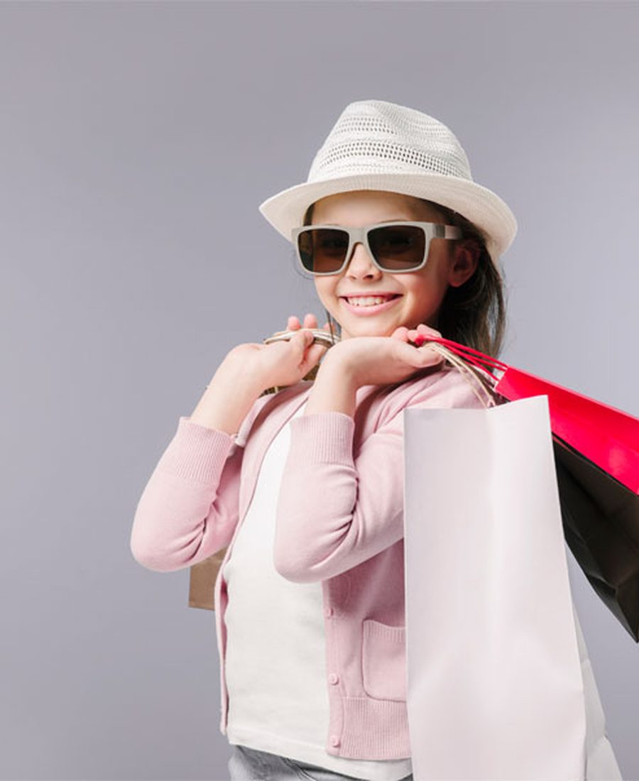Smiling shopper holding shopping bags
